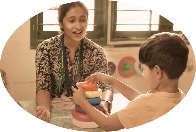Child learning with therapist during early intervention session